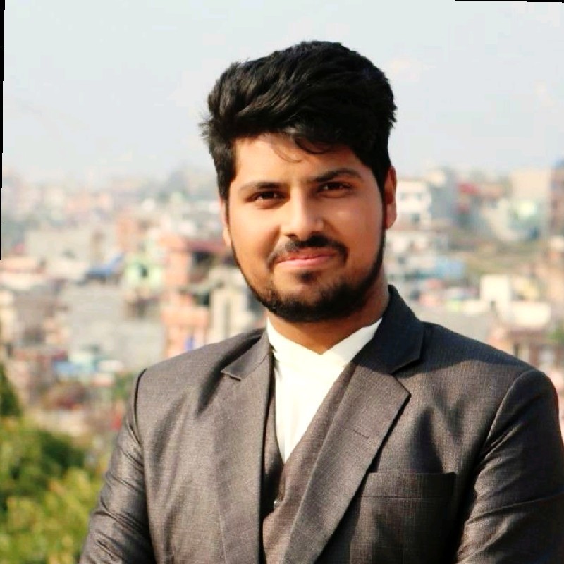 Biraj standing with Kathmandu in the background